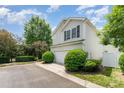 Charming two-story home with a two-car garage and well-manicured landscaping at 8734 Meadowmont View Dr, Charlotte, NC 28269