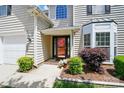 Charming two-story home with a well-manicured front yard and inviting entrance at 8833 Cavonnier Ln, Charlotte, NC 28216