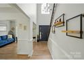 Bright foyer with hardwood floors and a view of the staircase at 8833 Cavonnier Ln, Charlotte, NC 28216