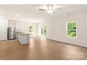 Open concept kitchen with stainless appliances, granite counters, and views to the backyard at 1542 Doran Ter, Richburg, SC 29729