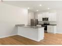 Bright kitchen with granite countertops and stainless steel appliances at 1544 Doran Ter, Richburg, SC 29729