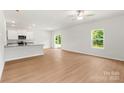 Spacious living room with luxury vinyl plank flooring and lots of natural light at 1544 Doran Ter, Richburg, SC 29729