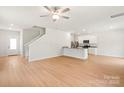 Open concept living room with easy access to kitchen and staircase at 1544 Doran Ter, Richburg, SC 29729
