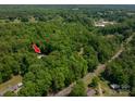 Lush treed lot with cozy home and in-ground pool for outdoor enjoyment at 174 Buena Vale Dr, Gastonia, NC 28056