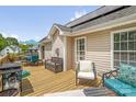 Enjoy the outdoors on this large deck with a grill, seating and views of the property at 208 N Kayla Dr, Salisbury, NC 28146