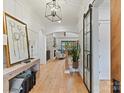 Elegant foyer with hardwood floors, barn door and a view of the living room at 2954 Holbrook Rd, Fort Mill, SC 29715