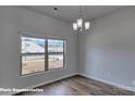 Light-filled living room featuring wood-look floors and a large window at 3905 Coleman Dr, Charlotte, NC 28215