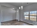 Bright, open living room with a large window, light gray walls, and wood-look flooring at 3905 Coleman Dr, Charlotte, NC 28215