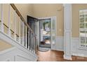 Bright entryway featuring an open door and detailed trim at 4729 Nijinsky Ct, Charlotte, NC 28216