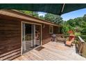 The back deck features a welcome mat near the sliding glass doors, grill and outdoor seating for enjoying the outdoors at 503 Overbrook Dr, Albemarle, NC 28001