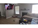 Cozy living room with a fireplace, large windows, and modern decor at 632 Pawley Dr, Charlotte, NC 28214