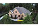 Stunning aerial view of a brick home with a well-manicured lawn and beautifully landscaped surroundings at 67 41St Nw Ave # 3, Hickory, NC 28601