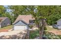Two-story home featuring a well-manicured lawn and mature trees in a residential neighborhood at 7218 Jacobs Fork Ln, Charlotte, NC 28273