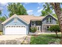 Charming two-story home with a two-car garage, landscaped yard, and inviting front entrance at 7218 Jacobs Fork Ln, Charlotte, NC 28273