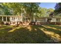 A sprawling backyard featuring a multi-windowed home and ample outdoor space for recreation at 981 Sherwood Cir, Lancaster, SC 29720