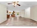 A bright living room with wood-look floors connects to the kitchen with a convenient breakfast bar at 1055 Cedar Hill Dr, Rockwell, NC 28138