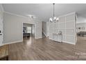 Bright, open-concept living room features hardwood floors and offers versatile space for office and living at 13315 Hunting Birds Ln, Charlotte, NC 28278