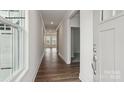 Bright foyer showcasing hardwood floors, neutral paint, and an open transition into the living spaces at 2053 Skyhawk Dr, York, SC 29745