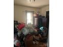 Bedroom filled with furniture, boxes, and belongings that need clearing at 216 Maple St, Statesville, NC 28677