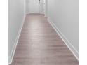 Bright hallway featuring light wood floors, white walls, and clean lines at 231 Miramar Dr, York, SC 29745