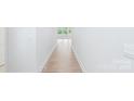 White hallway with wood floors leading to a bright room at 231 Miramar Dr, York, SC 29745
