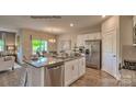 Modern kitchen with granite countertops, stainless steel appliances, and a large center island at 249 Giant Oak Ave, Statesville, NC 28677