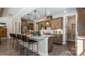 Spacious kitchen with granite island, wooden cabinets, stainless steel appliances, and walk in pantry at 3099 Trace Meadow Ct, York, SC 29745