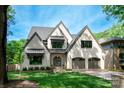 Charming two-story home featuring a symmetrical facade and gray-tone brick at 3524 Lacie Ln, Charlotte, NC 28211