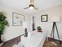 Well-lit home office featuring a modern desk, art, and a window for natural light at 4101 New Castle Ln, Monroe, NC 28110