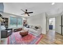 Cozy living room with a stylish rug, comfortable seating, and a large window for natural light at 456 Rainbow Cir, Clover, SC 29710