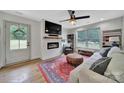 Inviting living room with fireplace, large windows, and stylish decor at 456 Rainbow Cir, Clover, SC 29710