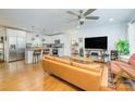 Combined living area and kitchen with wood flooring, tv and neutral colors at 4838 Holbrook Dr, Charlotte, NC 28212