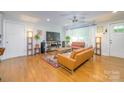 Bright living room with hardwood floors, stylish furniture, and ample natural light at 4838 Holbrook Dr, Charlotte, NC 28212