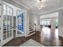 Spacious foyer with hardwood floors, decorative chandelier, and open view to living areas at 1001 Emory Ln, Fort Mill, SC 29708
