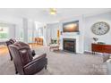 Cozy living room with a fireplace, neutral colors, and ample natural light at 1305 Glenview Ln, Rock Hill, SC 29730