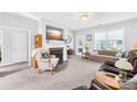 Bright living room with a fireplace, plush seating, large windows, and neutral tones for a cozy and inviting atmosphere at 1305 Glenview Ln, Rock Hill, SC 29730
