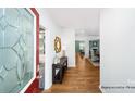 Inviting entryway with hardwood floors, decorative mirror, and seamless transition to living spaces at 143 Apple Orchard Ct, Statesville, NC 28677
