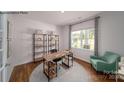 Bright home office with a large window, stylish shelving, and a comfortable chair at 143 Apple Orchard Ct, Statesville, NC 28677