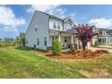 Stylish home with a fenced yard, a covered entrance and attractive landscaping at 1497 Striped Bass Ln, Clover, SC 29710