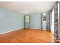 Bright living room features gleaming hardwood floors and natural light from two windows at 1509 Wiltshire Rd, Salisbury, NC 21844
