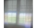 Windows covered by blinds, providing ample natural light and privacy to the room at 215 S Belvedere Ave, Gastonia, NC 28054