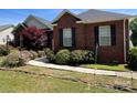 Charming brick home featuring well-maintained landscaping and walkway leading to the entrance at 2547 Bill Thompson Rd, Lancaster, SC 29720
