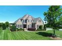 Stately two-story brick home boasts a lush green lawn, mature trees, and manicured landscaping for exceptional curb appeal at 3000 J R Ct, Stanley, NC 28164