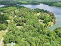 Beautiful aerial view showcasing the lake community with lush green surroundings and the serene lake at 4585 Sunrise Beach Rd, Catawba, NC 28609