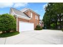 Spacious two-car garage and extended driveway provide ample parking at this brick-sided home at 5827 Rileys Ridge Rd, Charlotte, NC 28226