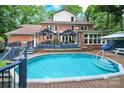 Refreshing backyard pool area with a spacious deck, providing an ideal space for relaxation and outdoor entertainment at 8524 Quarters Ln, Mint Hill, NC 28227