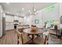 Bright living space featuring an open layout that connects the dining area, kitchen, and living room at 9305 Munsing Dr # 142, Charlotte, NC 28269