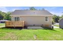 Back of house featuring a wooden deck, sliding glass door, and pleasant backyard at 953 Hardin Dr, Shelby, NC 28150