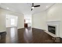Spacious living room with fireplace and dark hardwood floors at 1855 Second Baxter Xing, Fort Mill, SC 29708