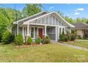 Attractive home showcasing manicured landscaping and a welcoming front porch at 222 N Weldon St, Gastonia, NC 28052